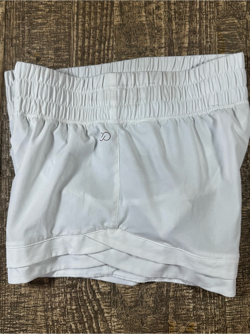 White Calia Running shorts. 2” inseam.